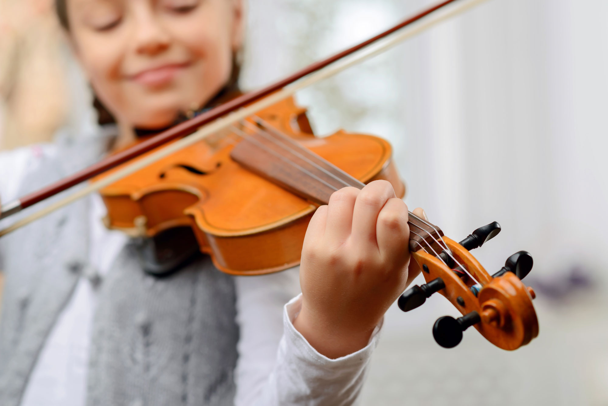 Student playing a violin