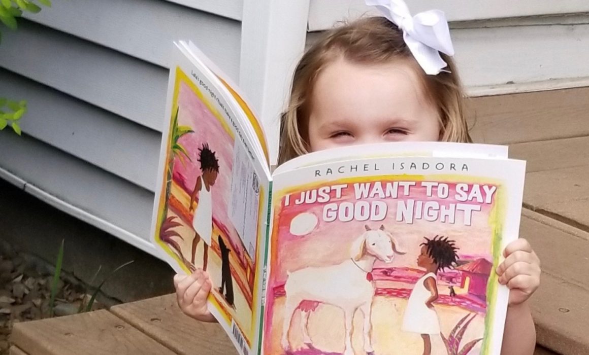 Girl reading I just want to say Good Night by Rachel Isadora